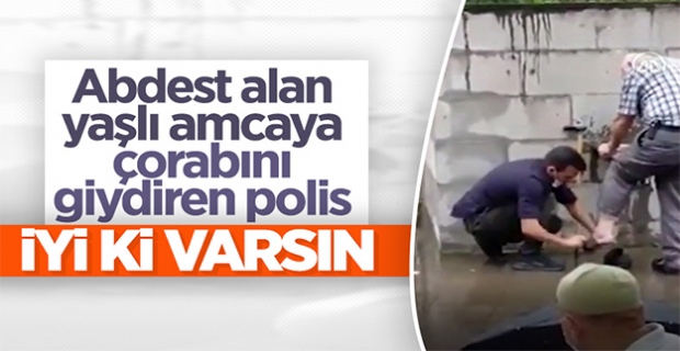 Rize'de polis, abdest alan yaşlı adamın çorabını giydirdi