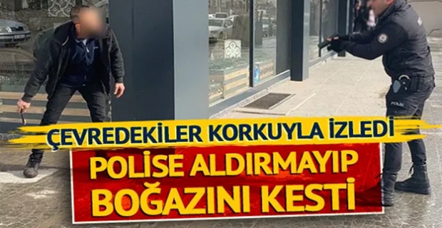 Çevredekiler korkuyla izledi, polise aldırmayıp boğazını kesti